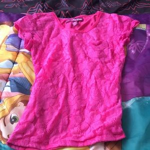 A floral designed pink shirt